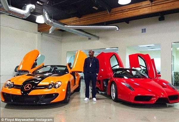 2B9A8DC400000578-3207942-Mayweather_while_out_shopping_for_cars_late_last_year_flanked_by-a-129_1440344730536