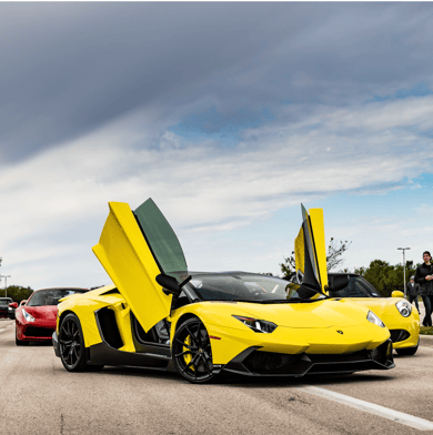 A yellow lamborghini aventador with door open