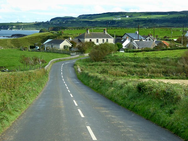 Part of the Causeway Coastal Route with houses and green scenery