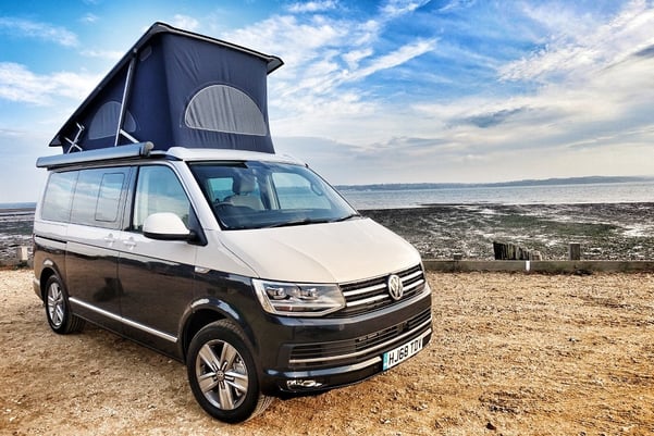 Campervan parked at the beach