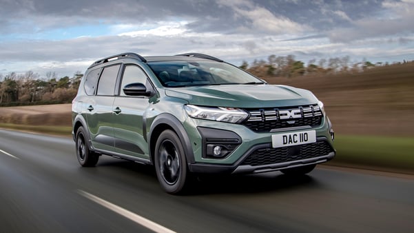 Green Dacia-Jogger on country road