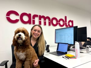 Woman with dog in office