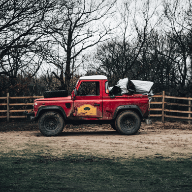 land rover in a farm field