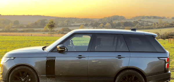 Grey Range Rover Vogue set to a countryside backdrop