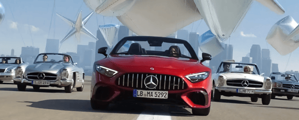 Five different Mercedes-Benz cars driving along the road
