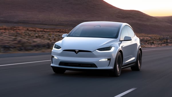 White Tesla Model X on country road