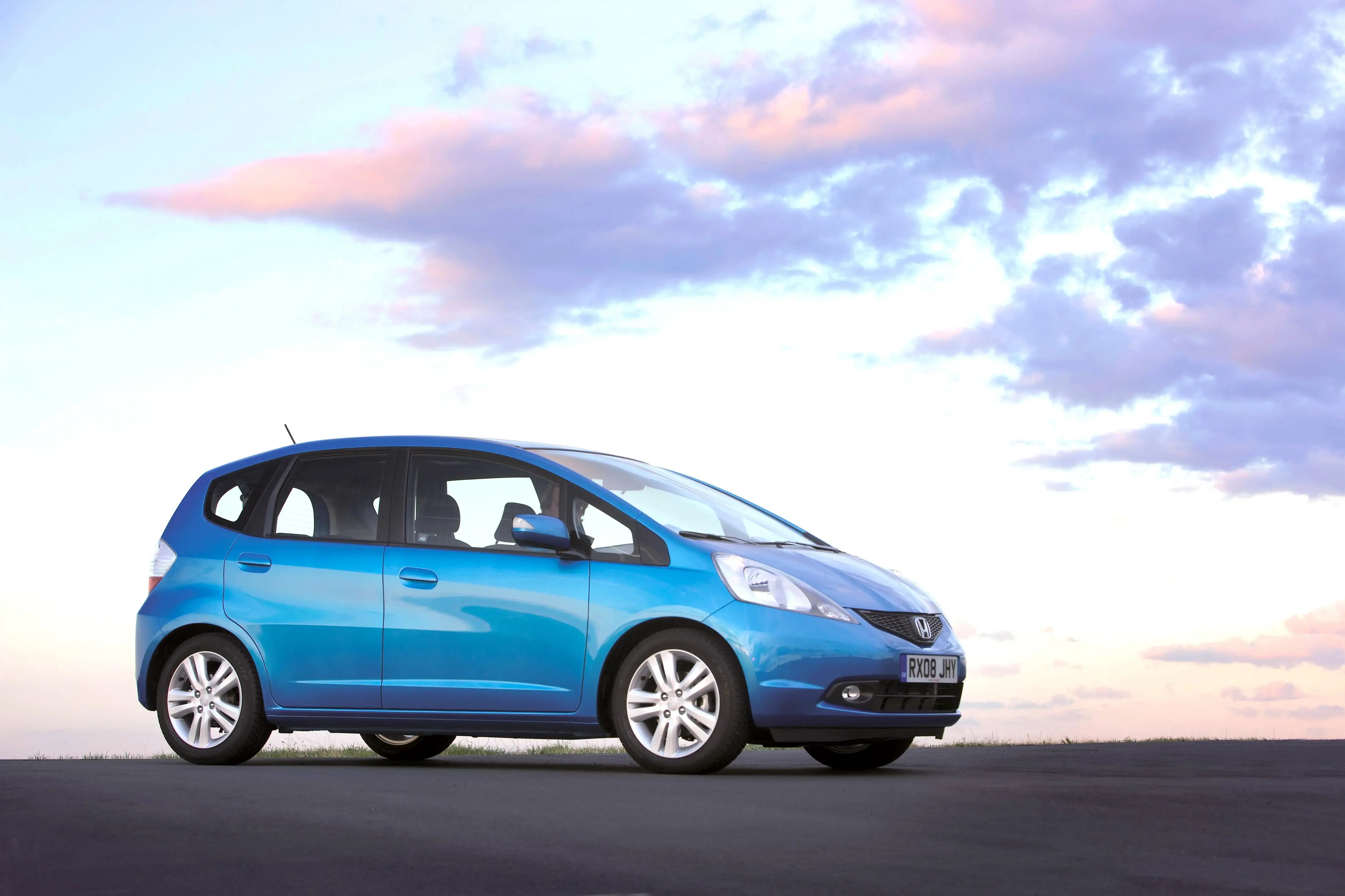 blue-Honda-Jazz-parked-side