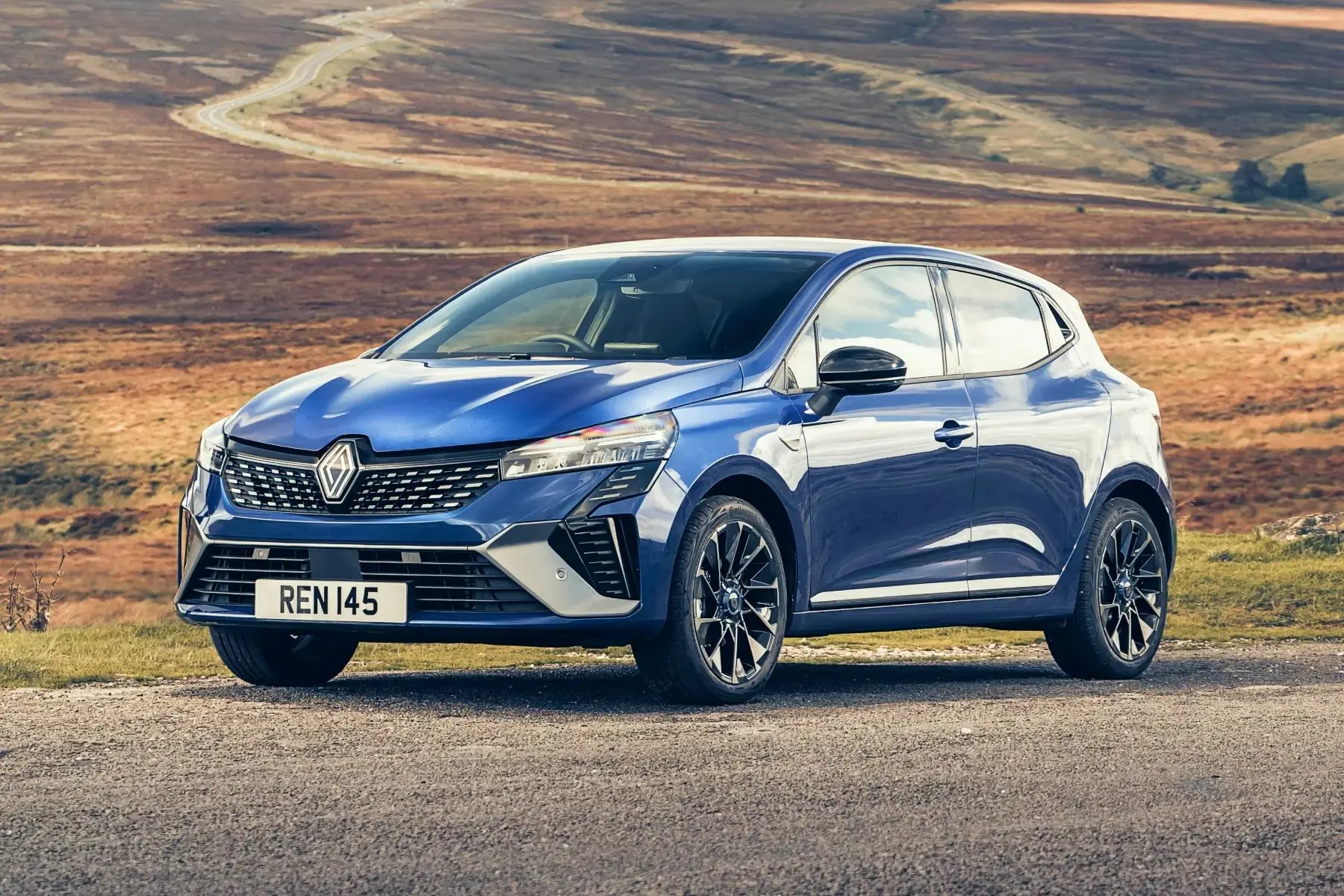 blue-Renault-Clio-parked-side