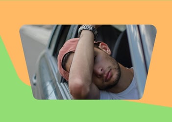 Despondent car driver leaning out of their window