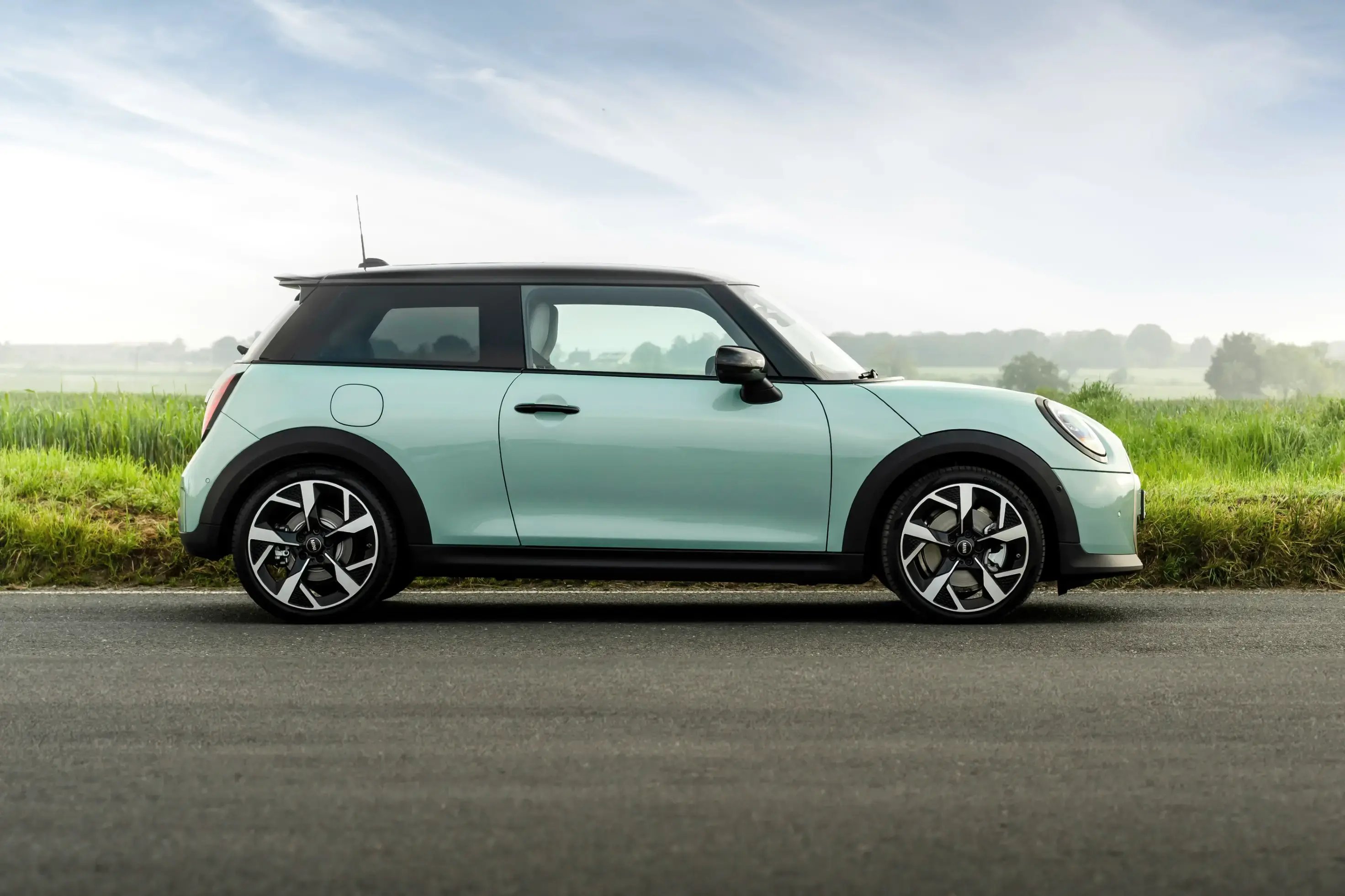 cyan-Mini-Cooper-parked-side