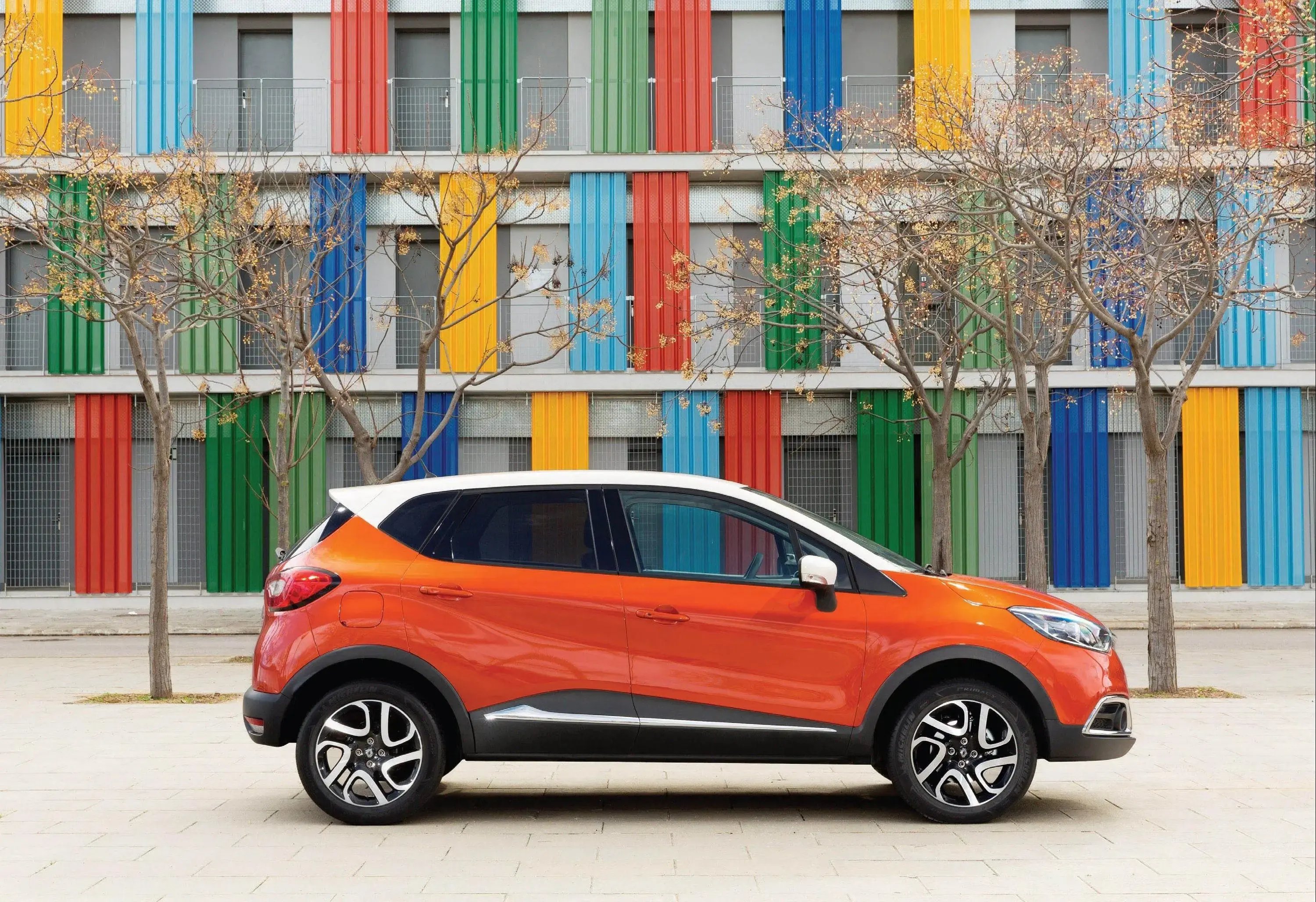 orange-Renault-Captur-parked-side