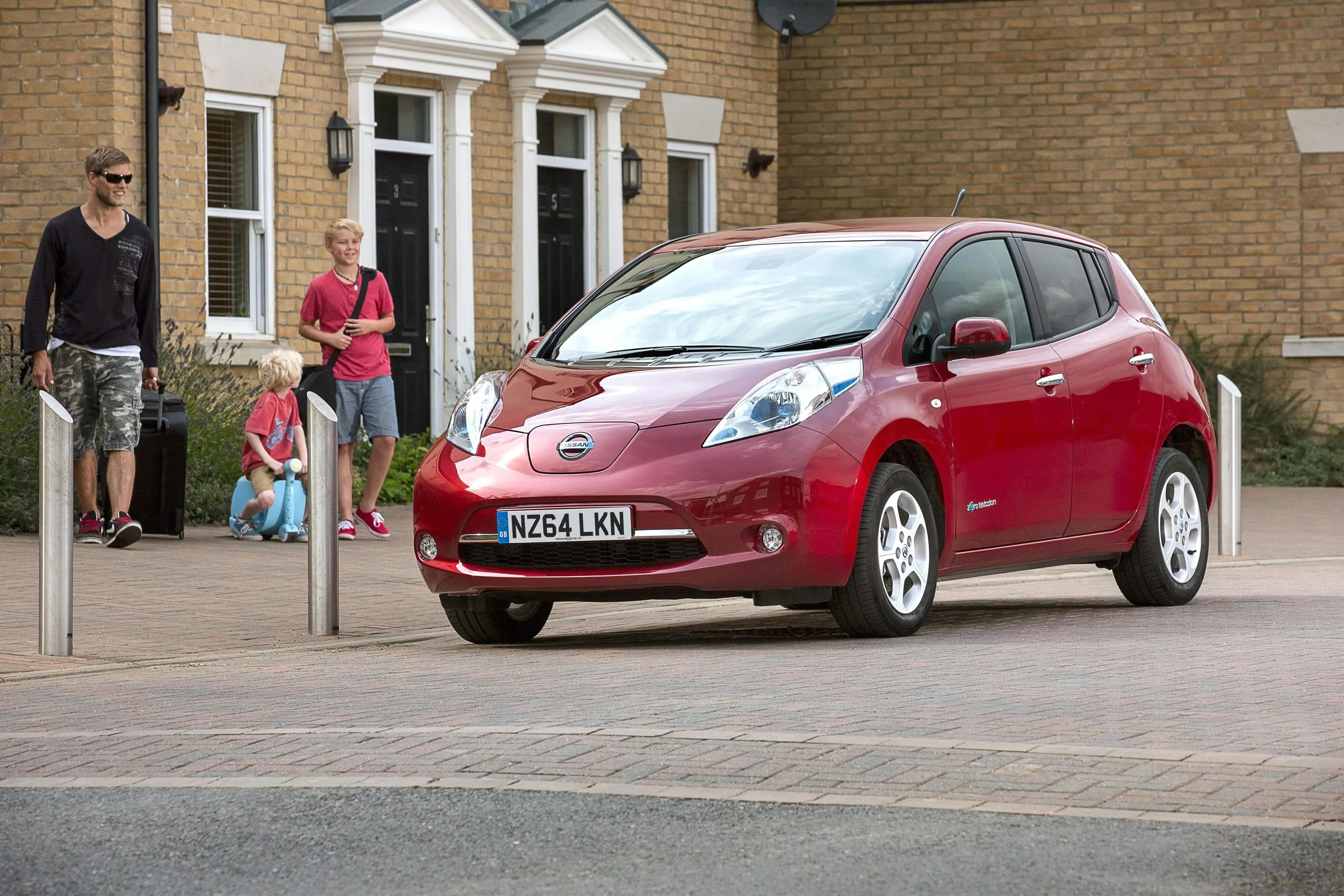 red-Nissan-Leaf-parked-front