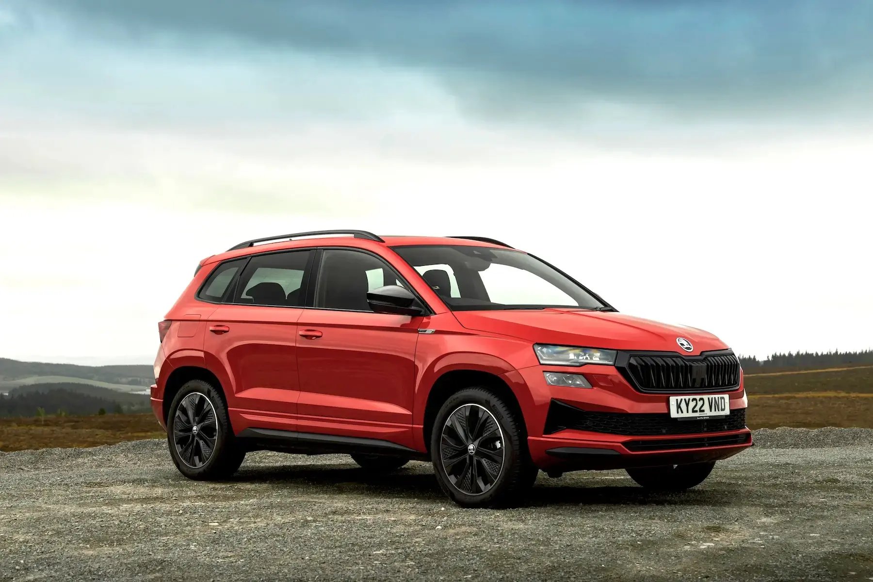 red-Skoda-Karoq-parked-side