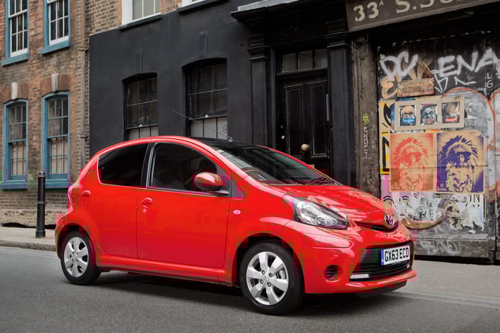 red-Toyota-Aygo-parked-side