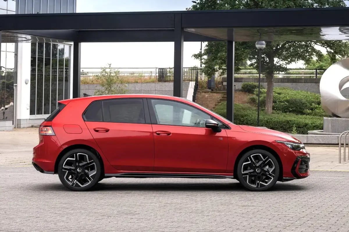 red-Volkswagen-Golf-parked-side