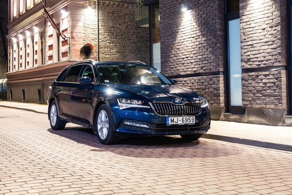 Blue Skoda Superb parked in the city