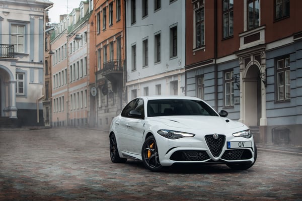 White Alfa Romeo Giulia Quadrifoglio in a street in Europe