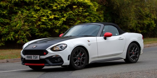 White Fiat Spider in the English countryside