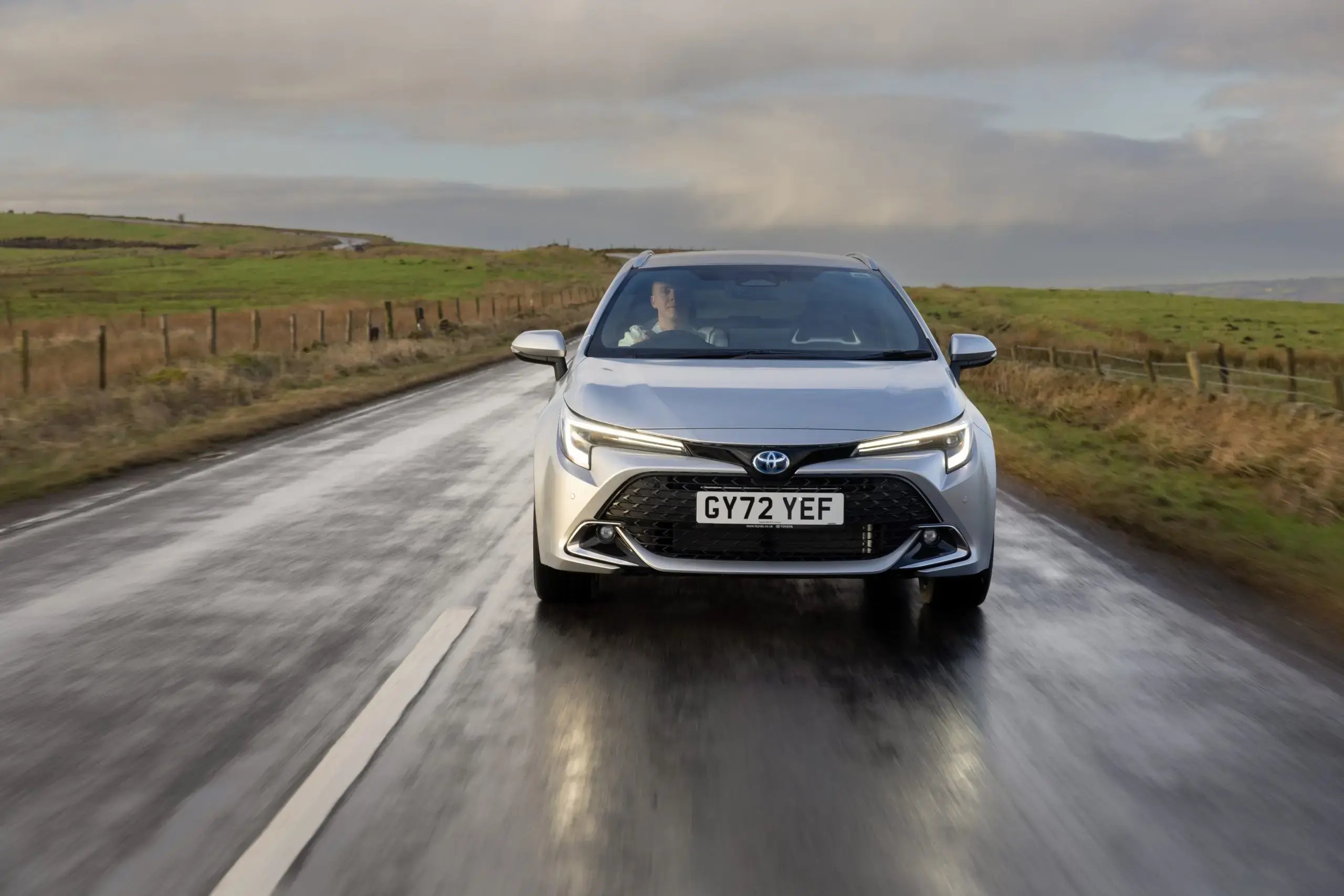 silver-toyota-corolla-touring-sports-dynamic-wet-countryroad-front