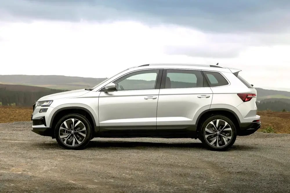 size-white-Skoda-Karoq-parked-side
