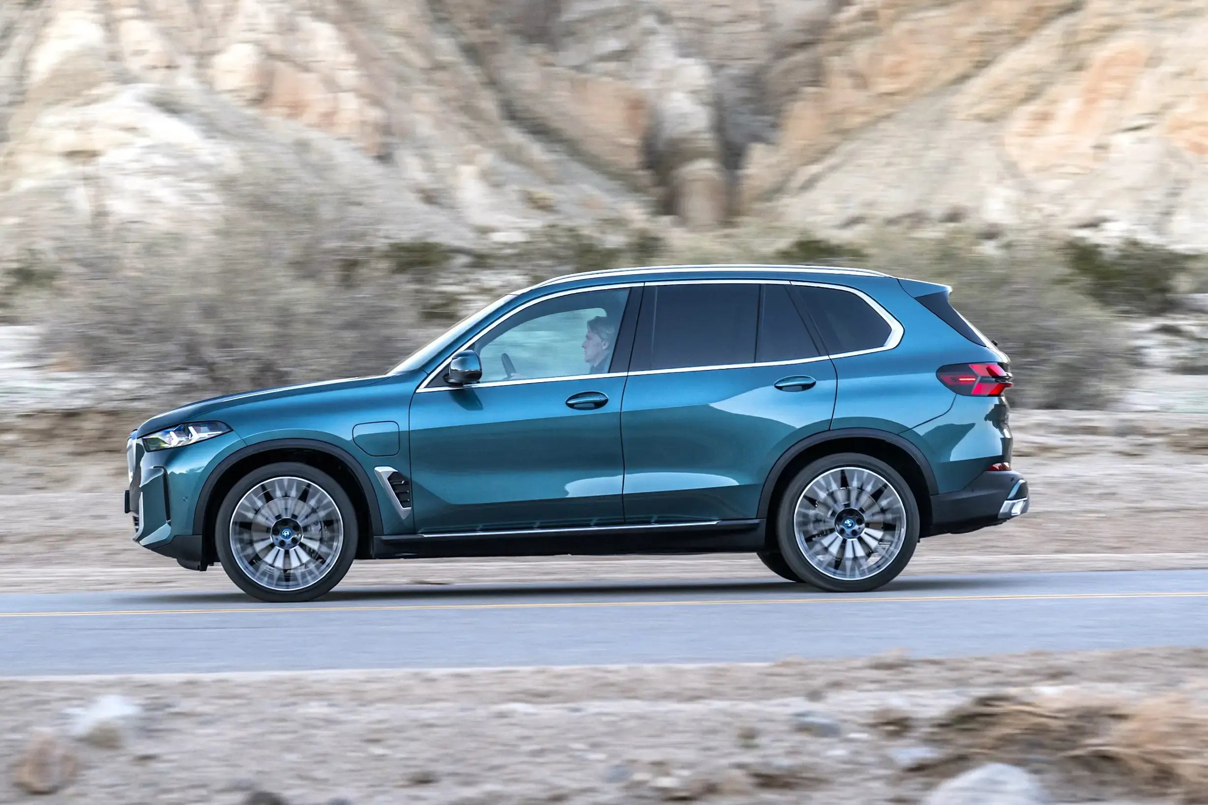 teal-BMW-X5-dynamic-side