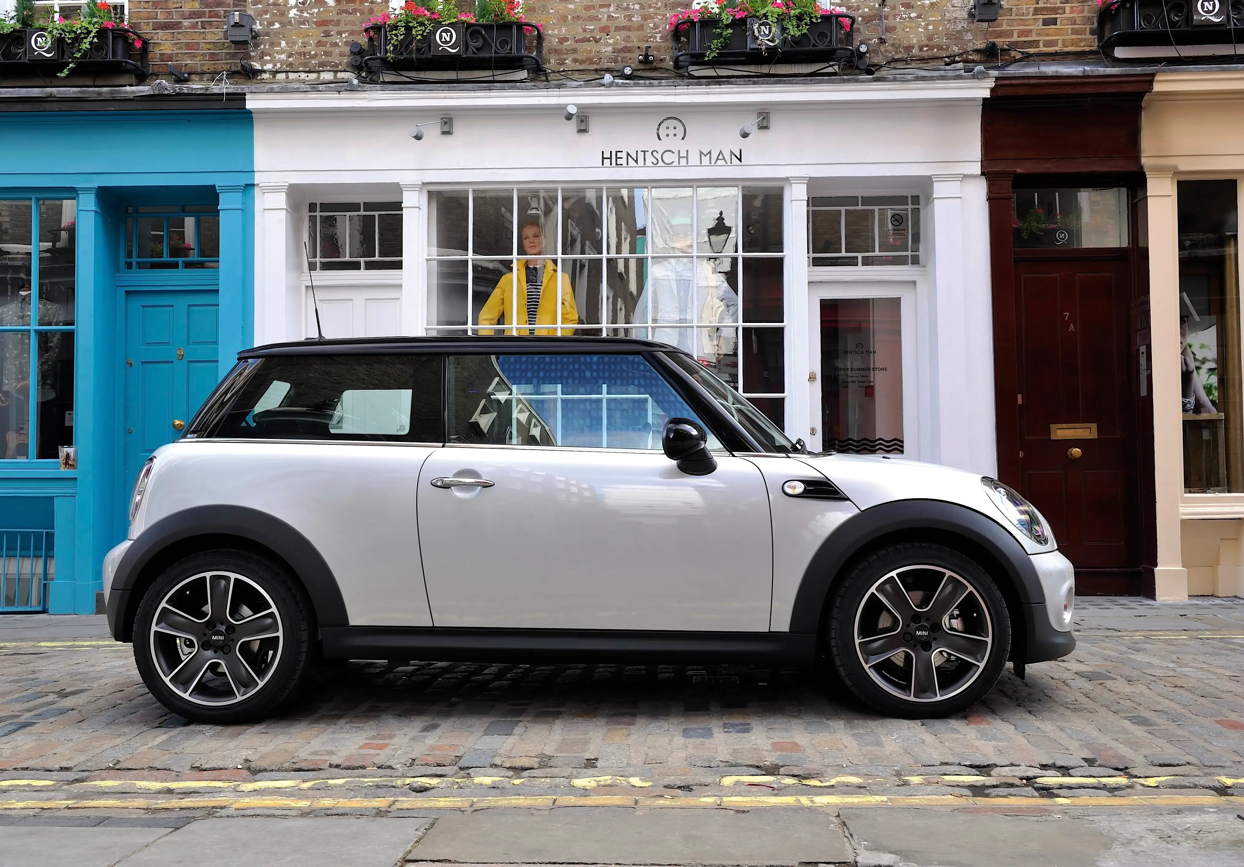 white-Mini-Hatch-parked-side