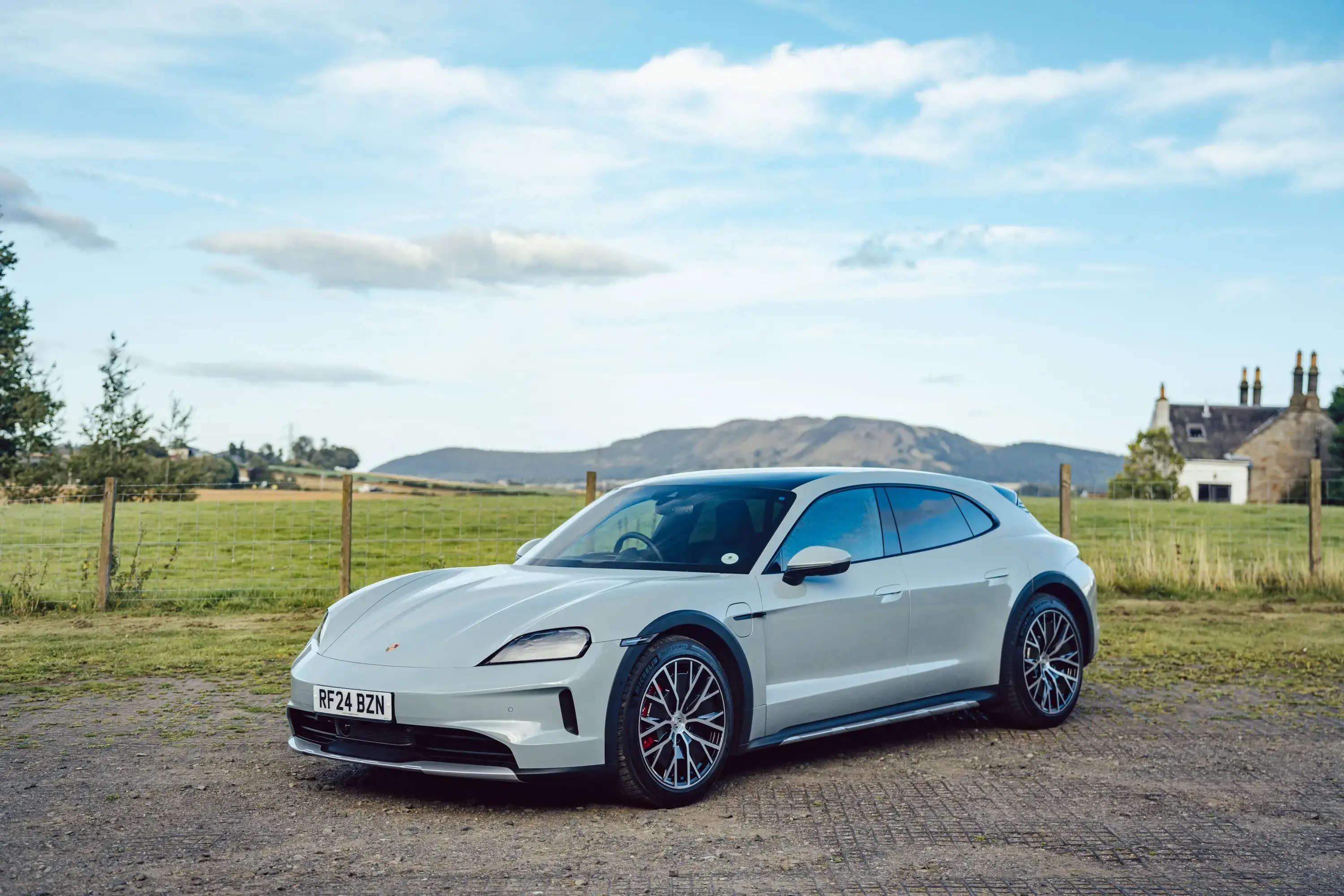 white-porsche-taycan-cross-turismo-parked-front